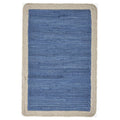 19" Set of Four Blue And Natural Solid With Border Cotton Placemats. Dining linen isolated on a plain white background, showing a tan linen surface.