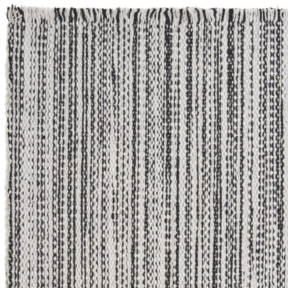 19" Set of Four Black And White Striped Cotton Placemats. Dining linen isolated on a plain white background, in a white linen finish.