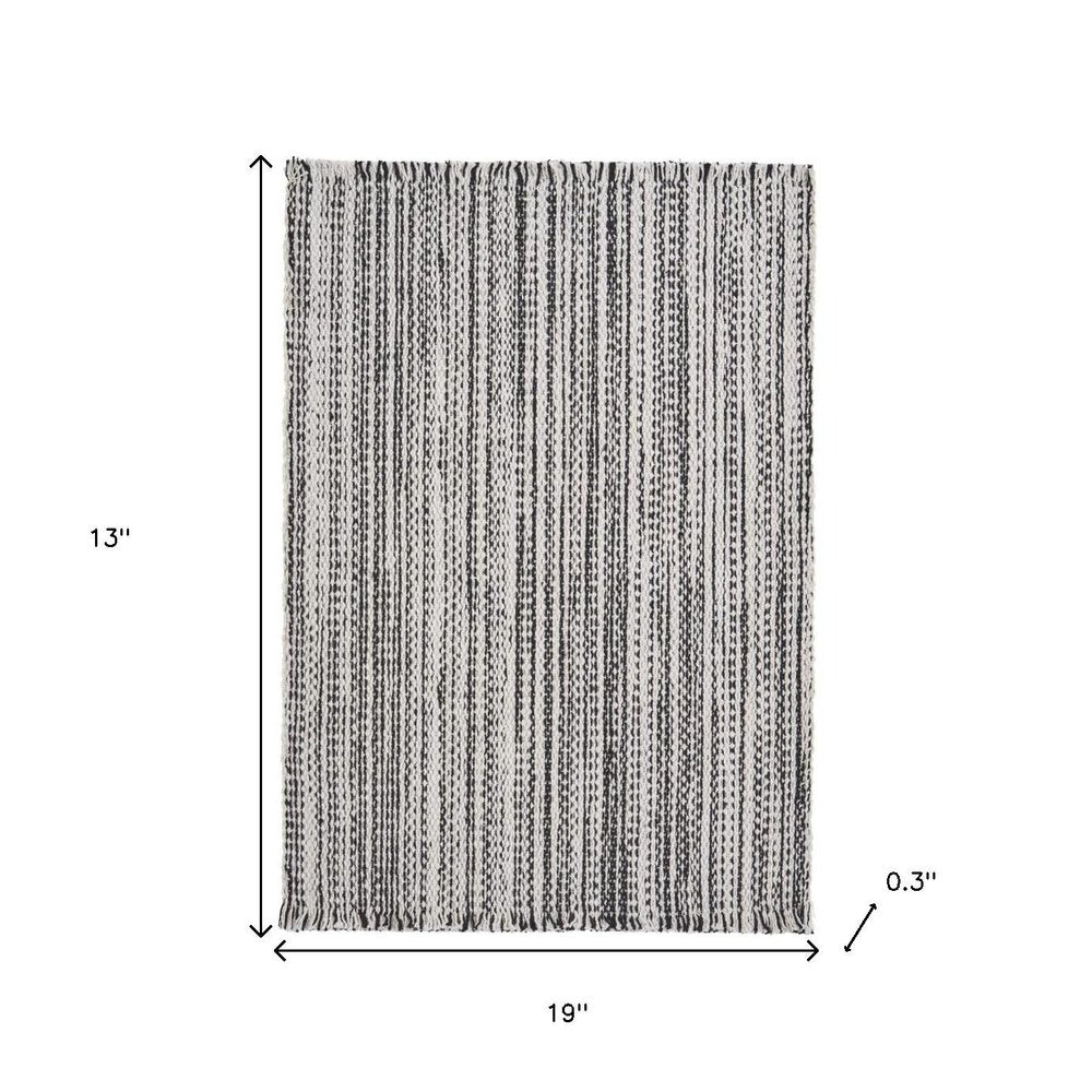 19" Set of Four Black And White Striped Cotton Placemats. Dining linen isolated on a plain white background, finished in white linen.
