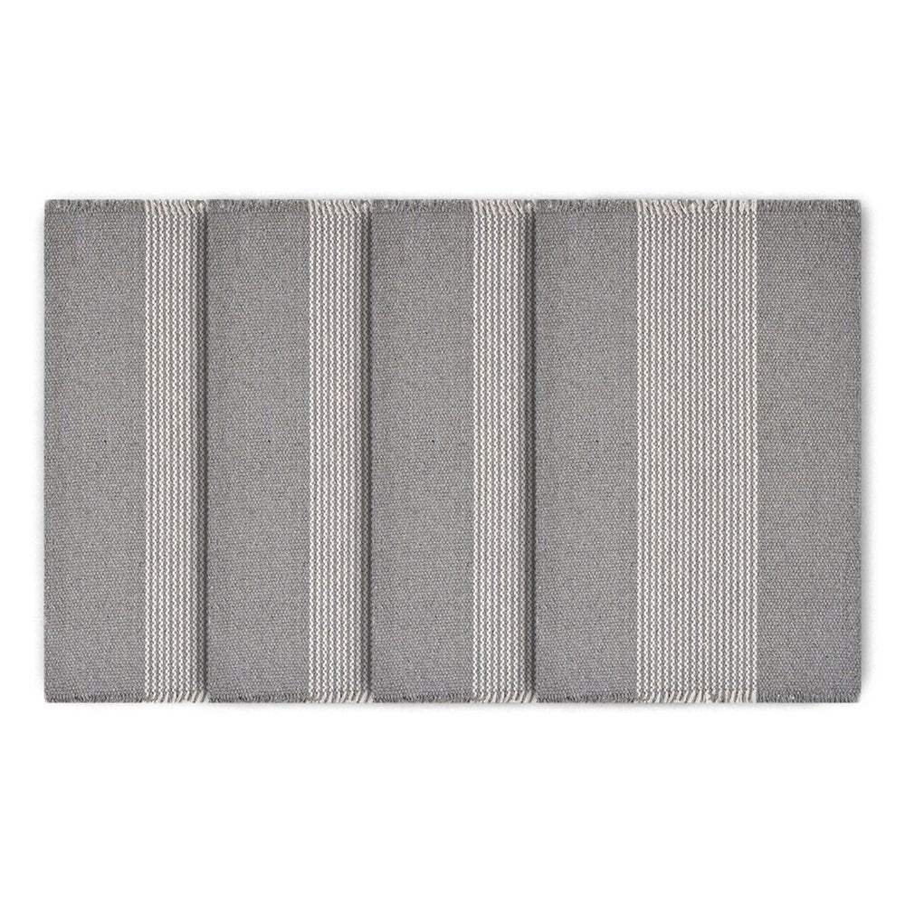 19" Set of Four Gray And White Striped Cotton Placemats. Dining linen isolated on a plain white background, finished in white linen.