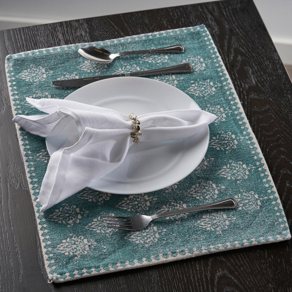 19" Set of Four Cream And Turquoise Damask Cotton Placemats photographed against a dark studio background.