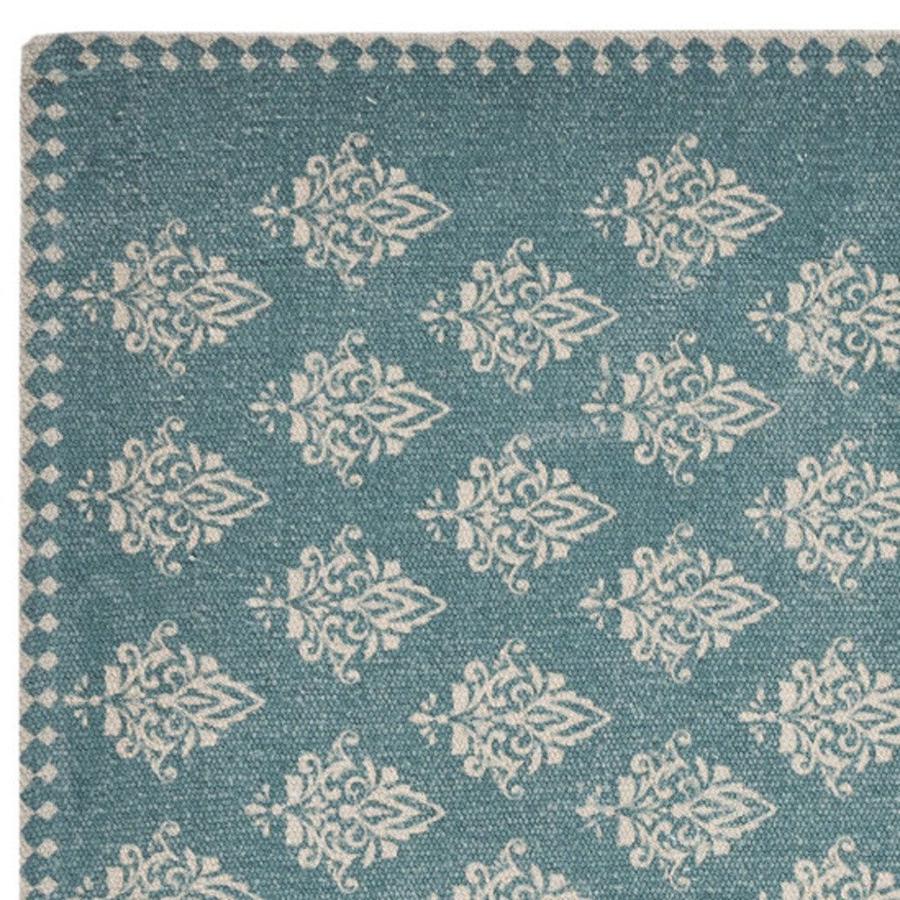 19" Set of Four Cream And Turquoise Damask Cotton Placemats close-up highlighting the linen surface.