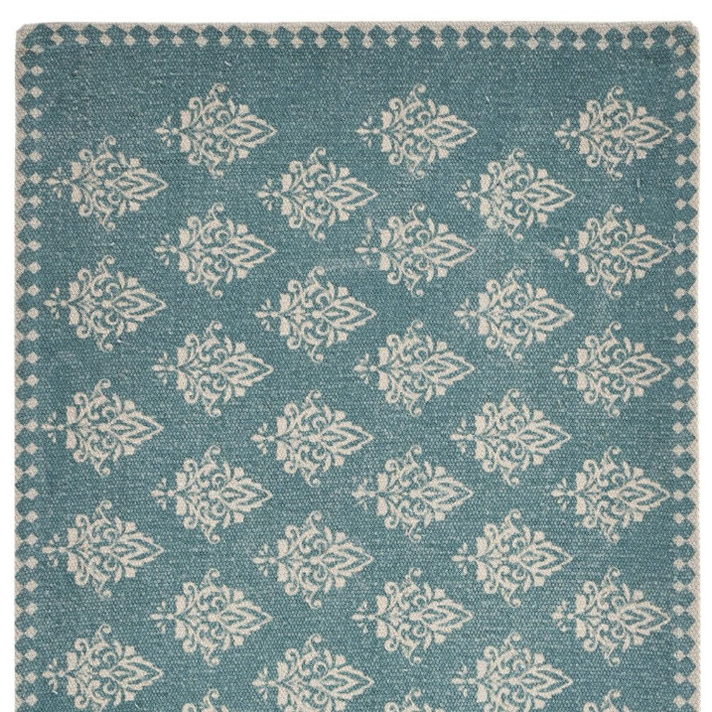 Close-up of 19" Set of Four Cream And Turquoise Damask Cotton Placemats showing the linen texture.