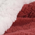 Twin Red And Orange Fleece Knitted Plush Blanket in a home interior