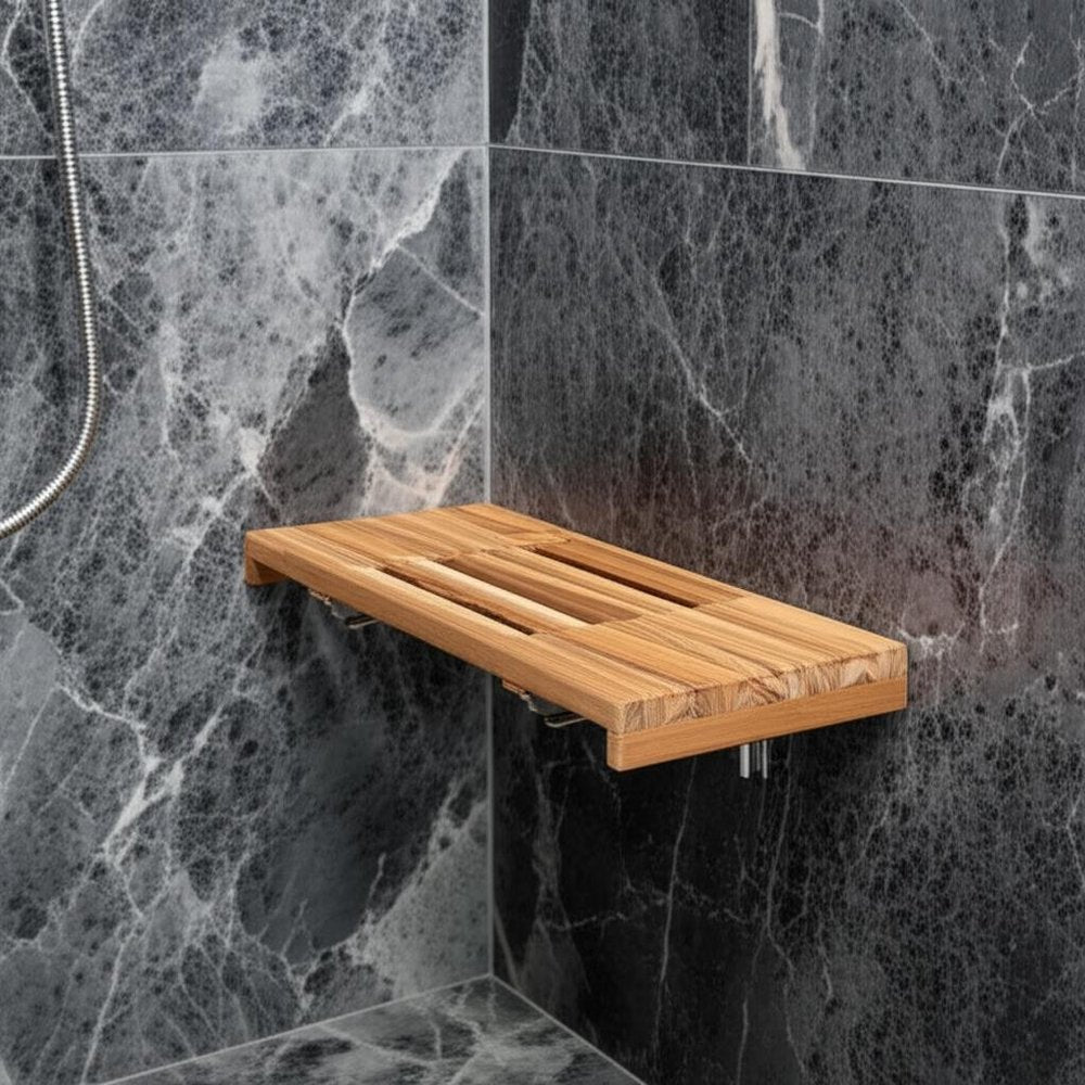 24" Brown Wall Mount Teak Rectangular Shower Bench styled in a furnished interior with a gray wall on a charcoal floor.