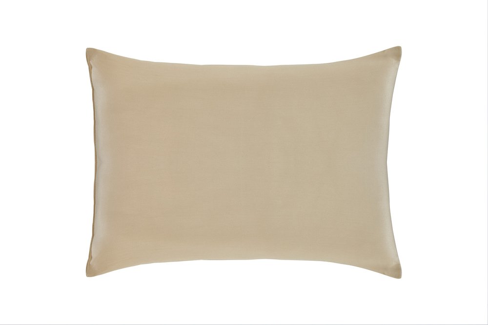 A plain beige cotton wool standard size bed pillow on a white background.