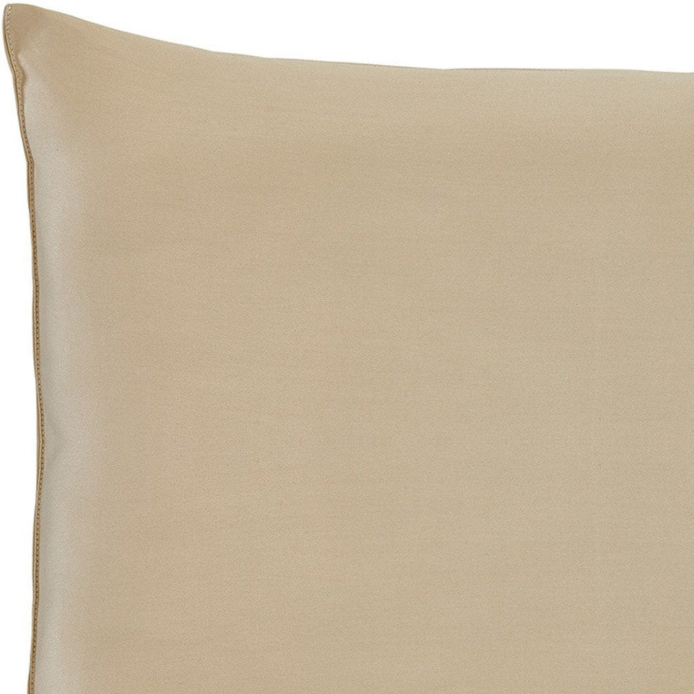 Close-up of a beige cotton wool hypoallergenic queen size bed pillow, showing the textured fabric and stitching.