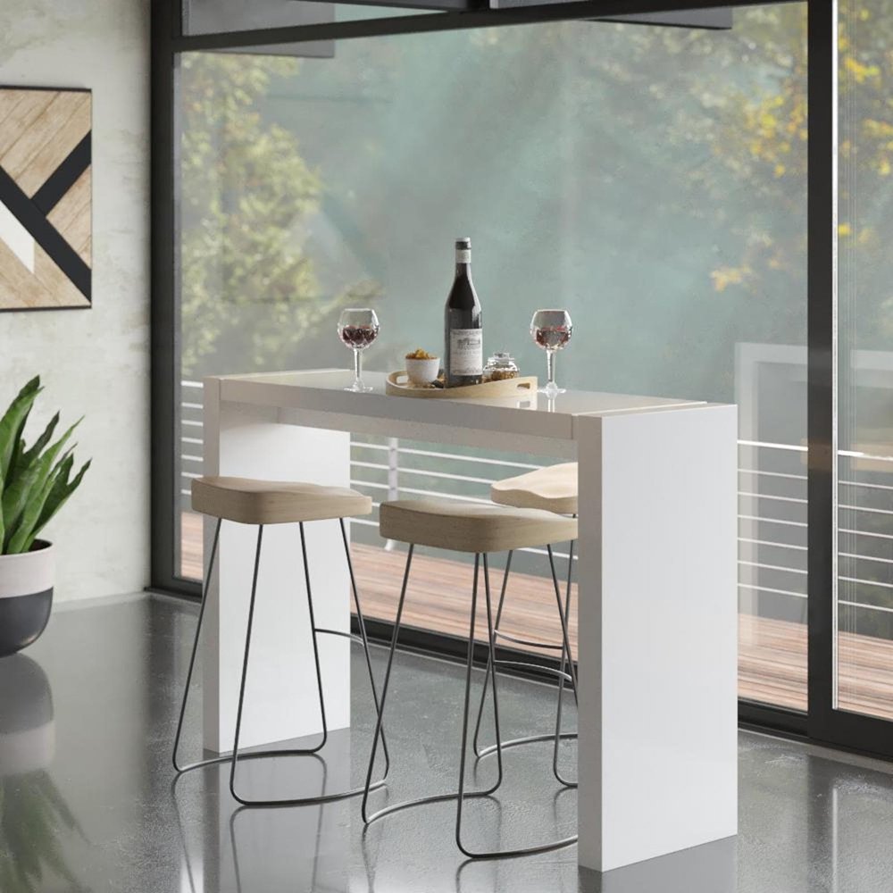 60" White Wood Rectangular Bar Height Bar Table styled in a furnished interior with a gray wall on a tiled floor.