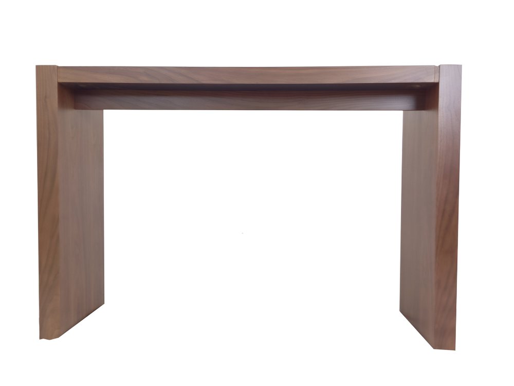 A brown wood rectangular bar height bar table with a simple design against a white background.