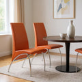 Set of Two Orange And Silver Upholstered Faux Leather Dining Side Chairs