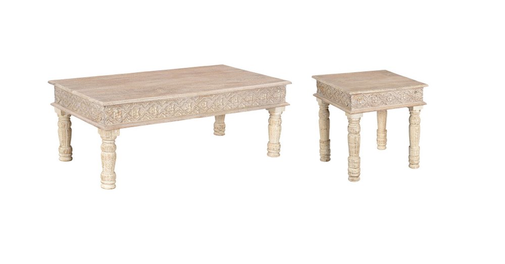 Set of two distressed natural solid wood coffee tables with carved details on a white background.