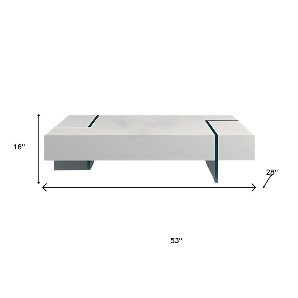 53" White And Clear Wood And Glass Sled Coffee Table. Coffee table isolated on a plain white background, showing a white glass surface.