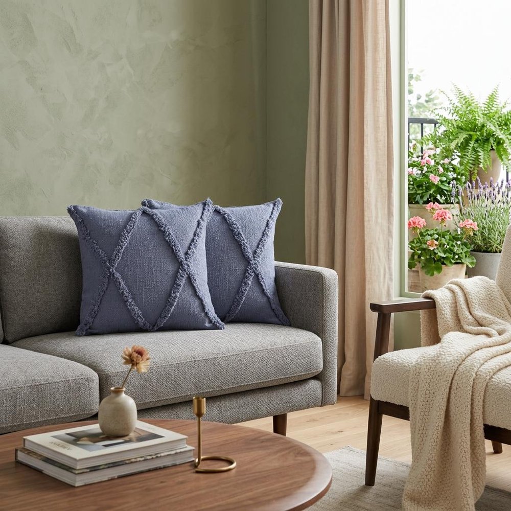 Set of Two Blue Diamond Cotton Throw Pillow With Fringe in a home interior