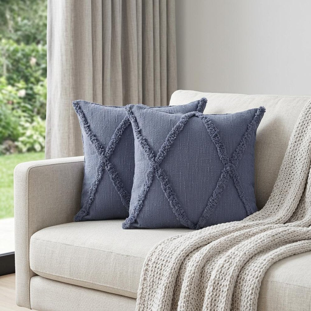 Set of Two Blue Diamond Cotton Throw Pillow With Fringe in a home interior