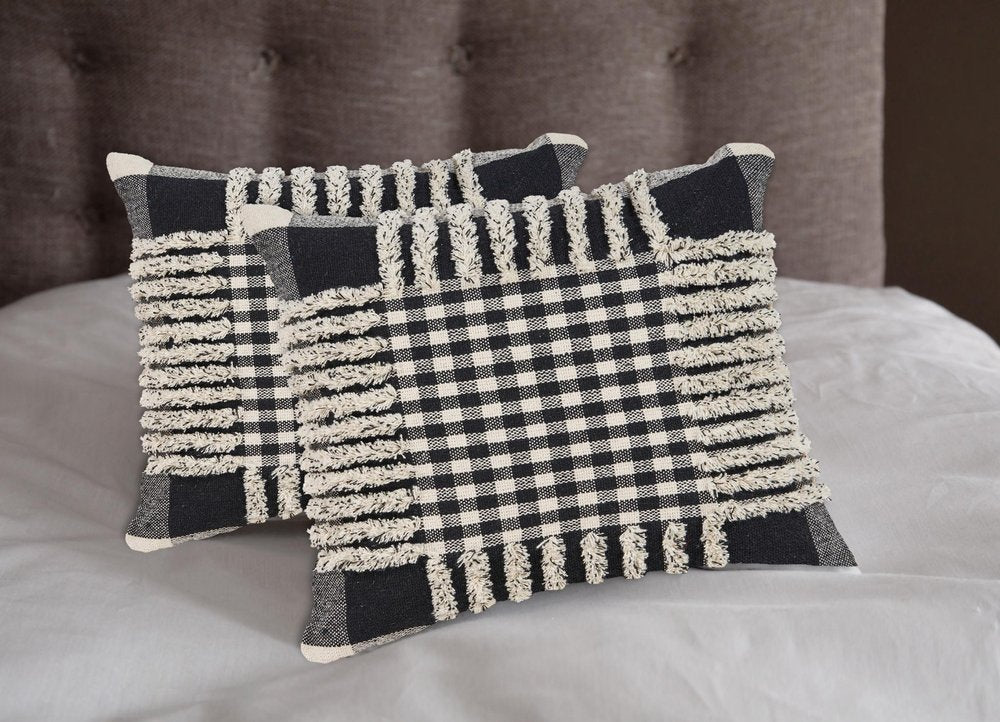 Set of Two Black and Ivory Plaid Cotton Throw Pillow With Fringe in a home interior