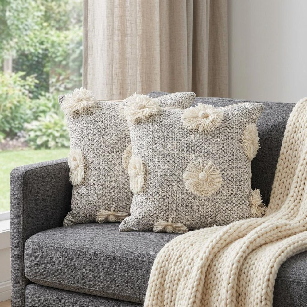 Set of Two Gray and Ivory Floral Cotton Throw Pillows With Fringe in a home interior