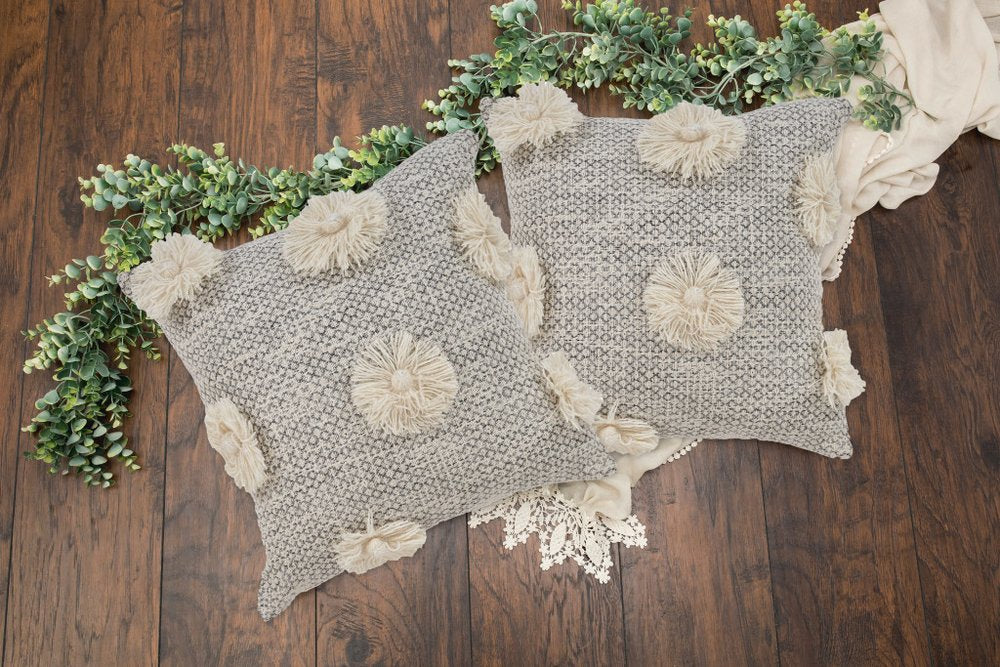 Set of Two Gray and Ivory Floral Cotton Throw Pillows With Fringe in a home interior