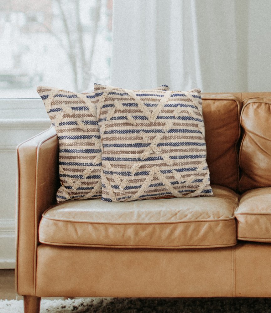 Set of Two Blue Diamond Cotton Throw Pillow With Fringe in a home interior