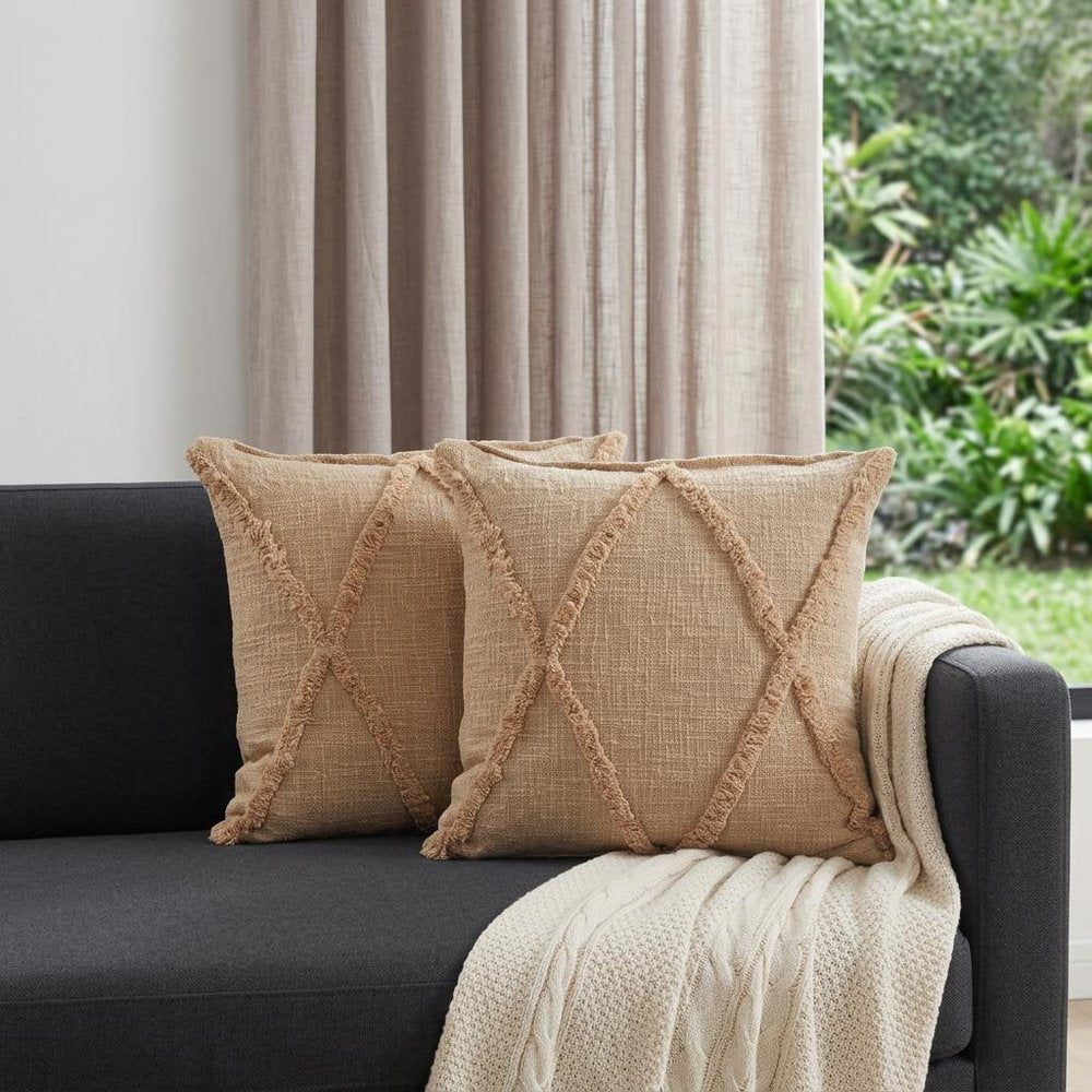 Set of Two Tan Diamond Cotton Throw Pillow With Fringe in a home interior