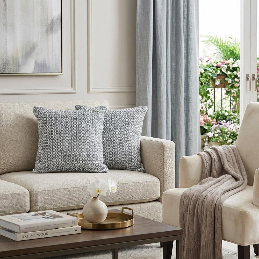 Set of Two Gray and White Geometric Cotton Throw Pillow in a home interior