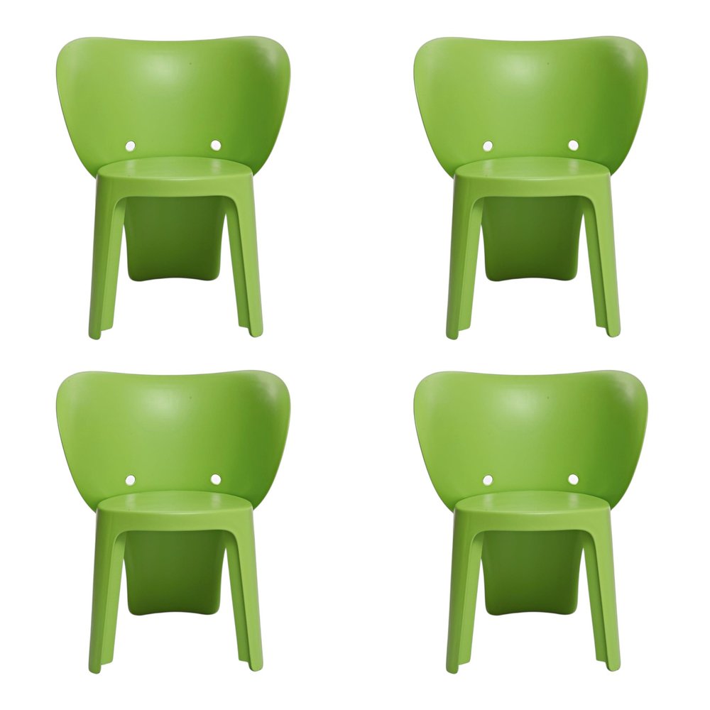 Set Of Four Green Heavy Duty Plastic Juvenile Chairs on a white background