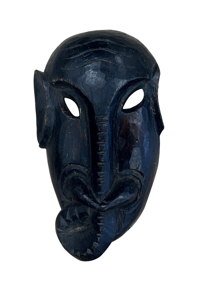 10" Black Solid Wood Decorative Mask Tabletop Sculpture. Sculpture isolated on a plain white background, showing a black wood surface.