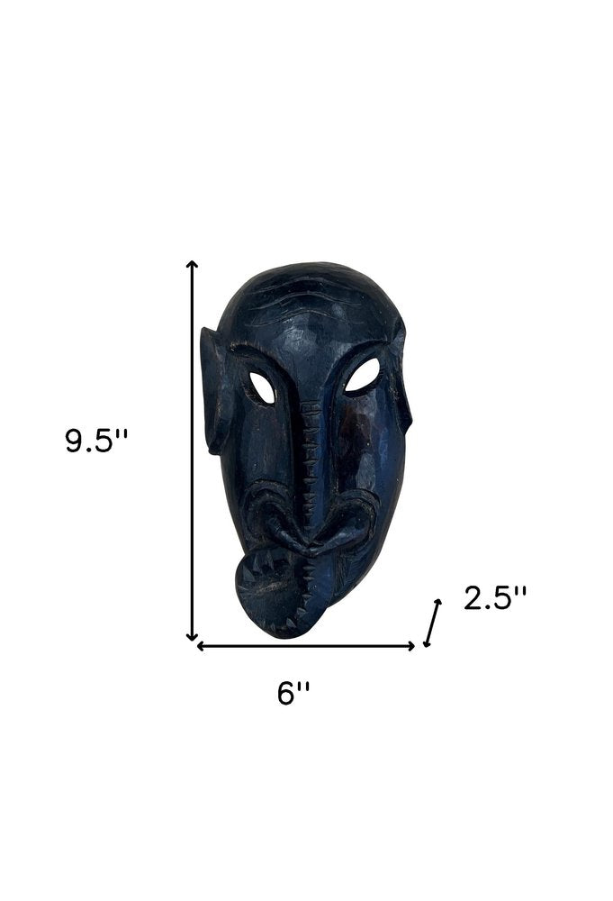 10" Black Solid Wood Decorative Mask Tabletop Sculpture. Sculpture isolated on a plain white background, showing a black wood surface.