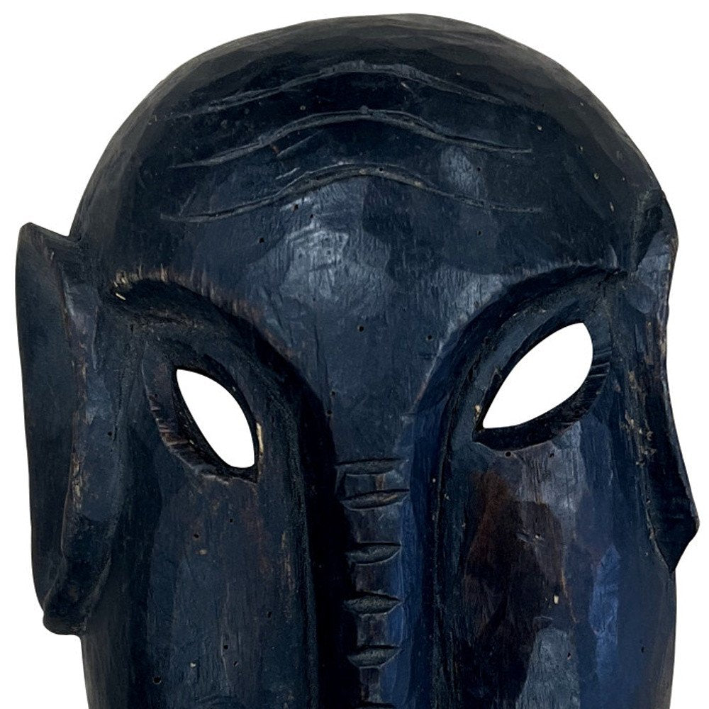 10" Black Solid Wood Decorative Mask Tabletop Sculpture. Sculpture isolated on a plain white background, finished in black wood.