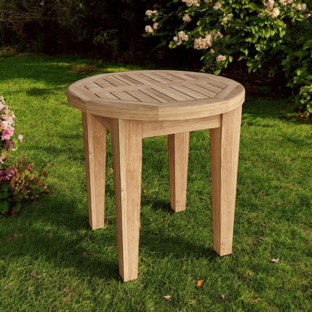 20" Natural Rounded Solid Wood Outdoor Side Table shown outdoors on a patio with greenery.