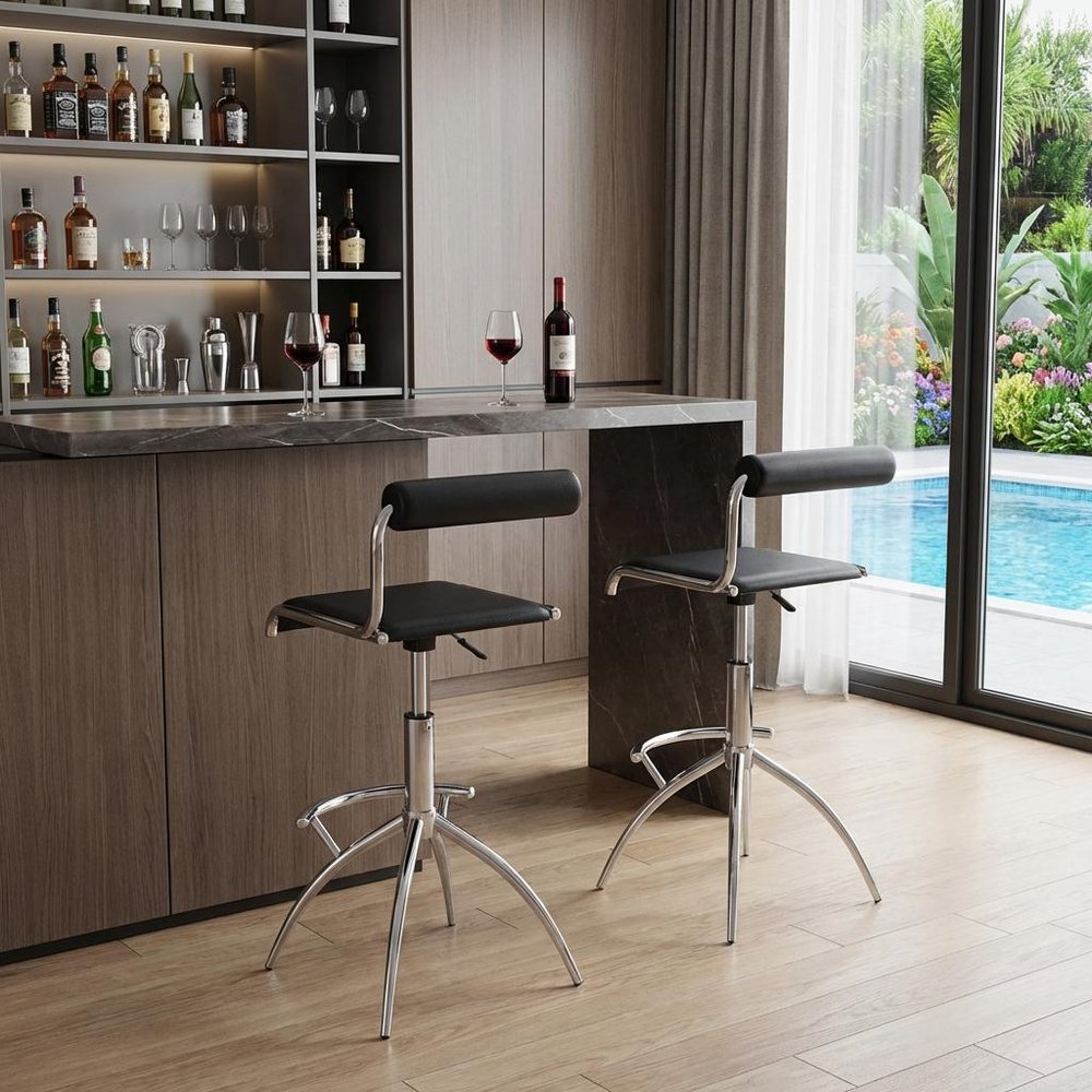 Set of Two Black And Silver Faux Leather And Metal Low Back Adjustable Height Bar Chairs in a home interior