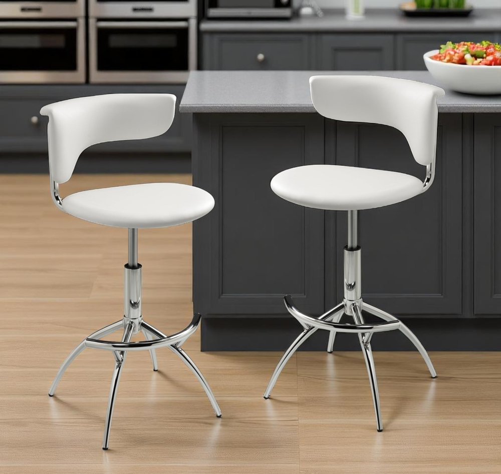 Set of Two White And Silver Faux Leather And Metal Low Back Adjustable Height Bar Chairs in a home interior