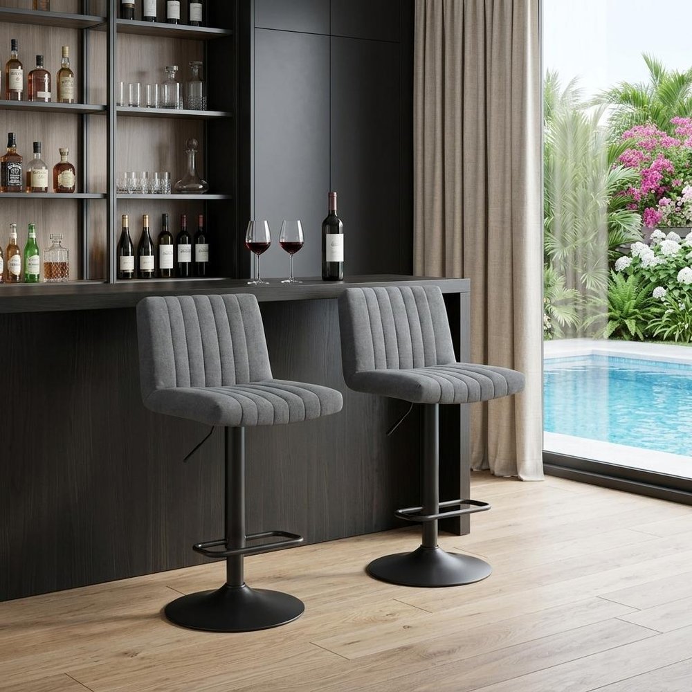 Set of Two Gray And Black Fabric And Metal Low Back Adjustable Height Bar Chairs in a home interior