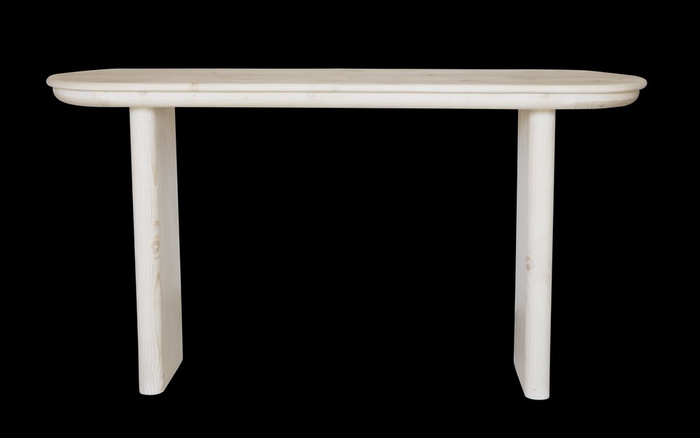 60" Natural Solid Wood Oval Console Table photographed against a dark studio background in tan.