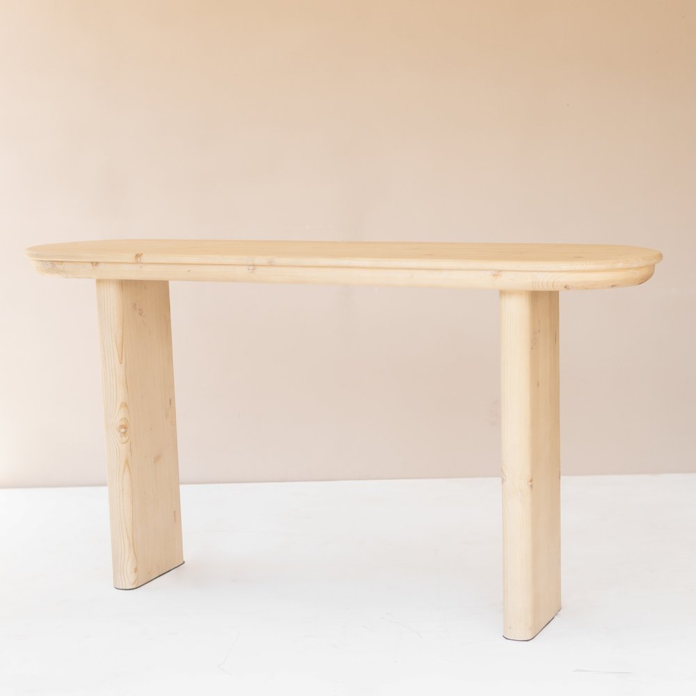60" Natural Solid Wood Oval Console Table. Console table isolated on a plain white background, finished in tan wood.