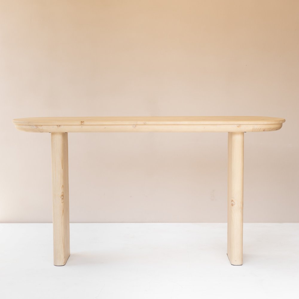 60" Natural Solid Wood Oval Console Table. Console table in tan wood.