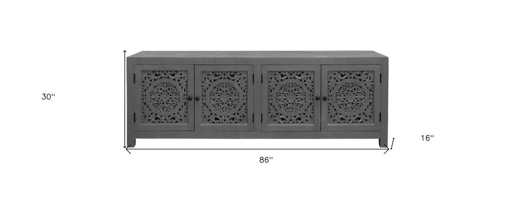 86" Dark Gray Carved Floral Distressed Solid Wood Enclosed Storage TV Stand on a white background