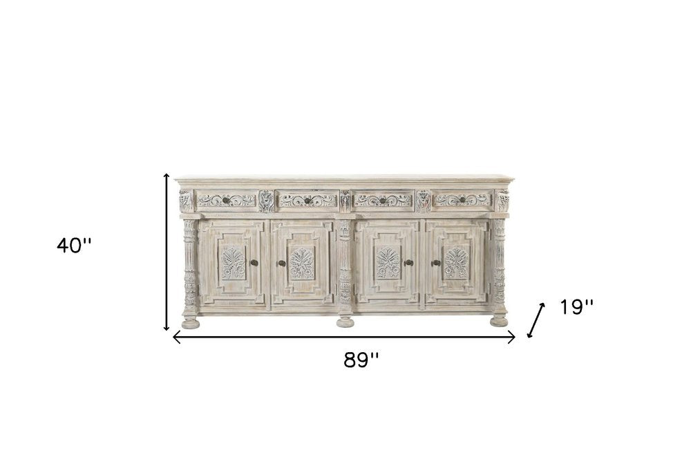 89" White Distressed Solid Wood Carved Scrollwork Four Drawer Sideboard With Four Doors on a white background