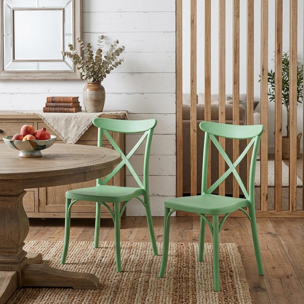Set of Two Green Heavy Duty Plastic Outdoor Stacking Dining Chairs in a home interior