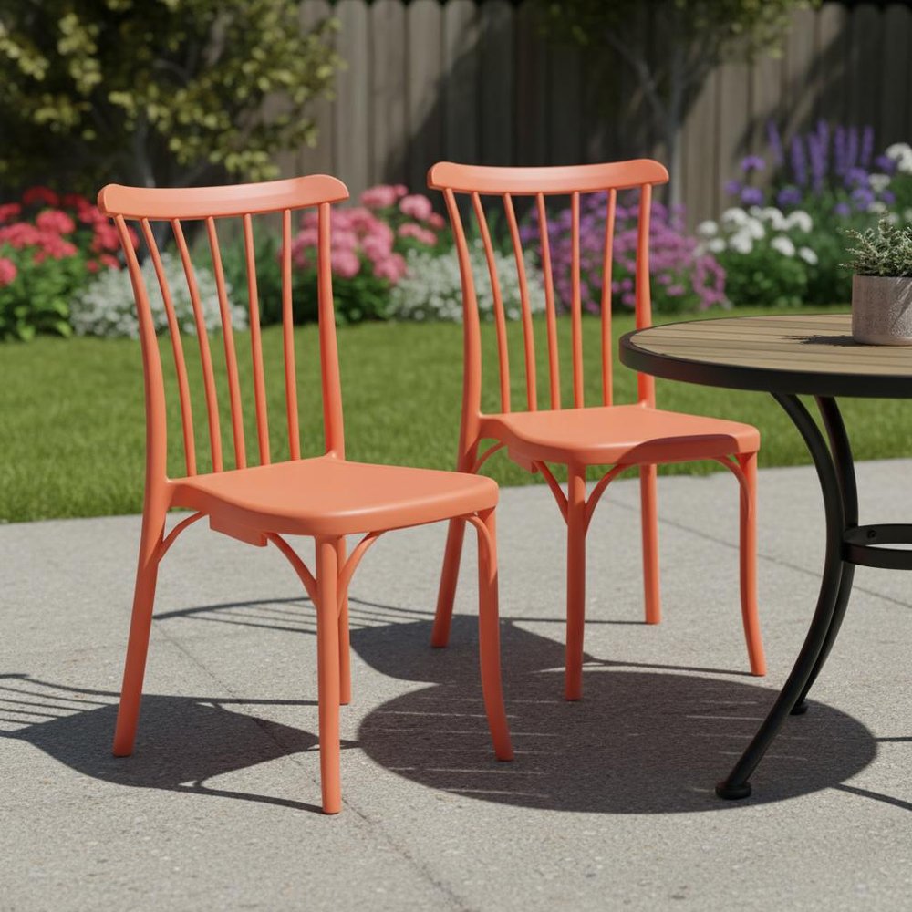 Set of Two Salmon Heavy Duty Plastic Outdoor Stacking Dining Chairs in a home interior