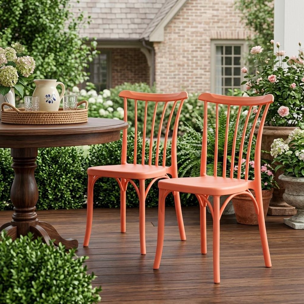 Set of Two Salmon Heavy Duty Plastic Outdoor Stacking Dining Chairs in a home interior