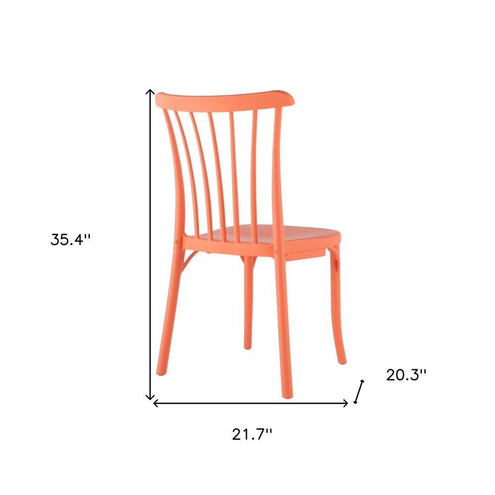 Set of Two Salmon Heavy Duty Plastic Outdoor Stacking Dining Chairs on a white background