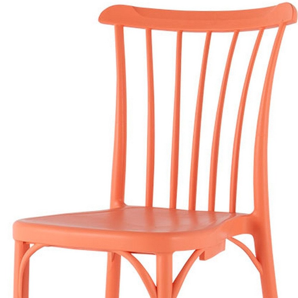 Set of Two Salmon Heavy Duty Plastic Outdoor Stacking Dining Chairs on a white background