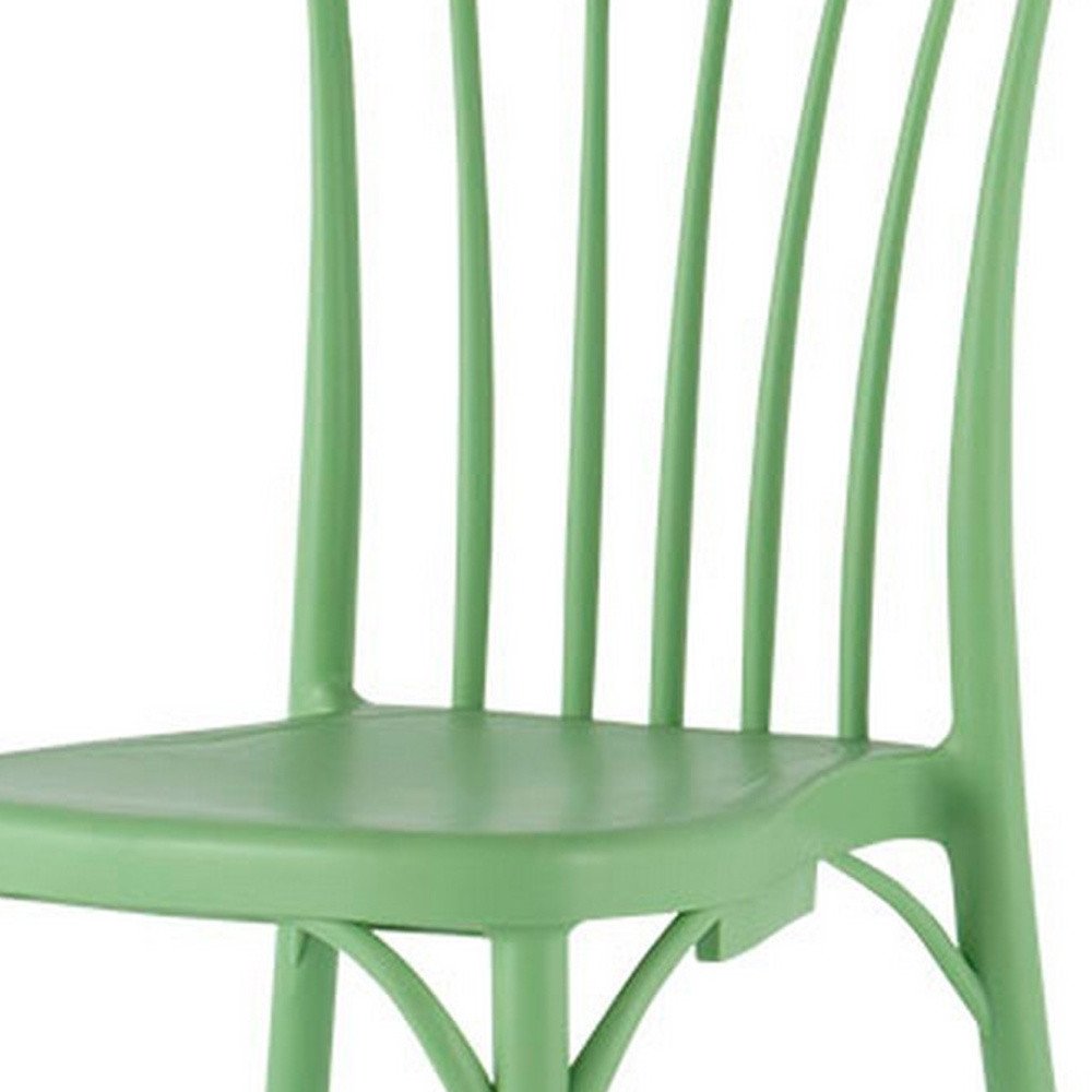 Set of Two Green Heavy Duty Plastic Outdoor Stacking Dining Chairs on a white background