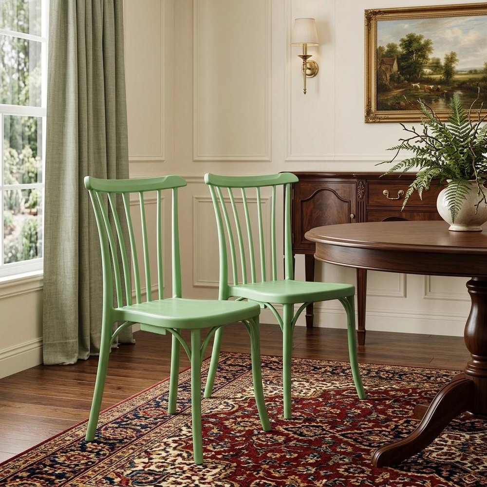 Set of Two Green Heavy Duty Plastic Outdoor Stacking Dining Chairs in a home interior