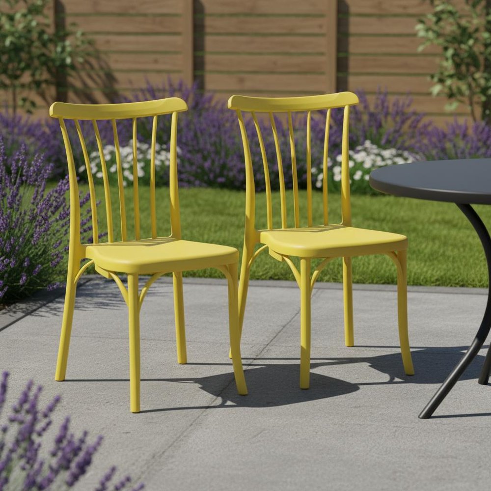 Set of Two Yellow Heavy Duty Plastic Outdoor Stacking Dining Chairs in a home interior