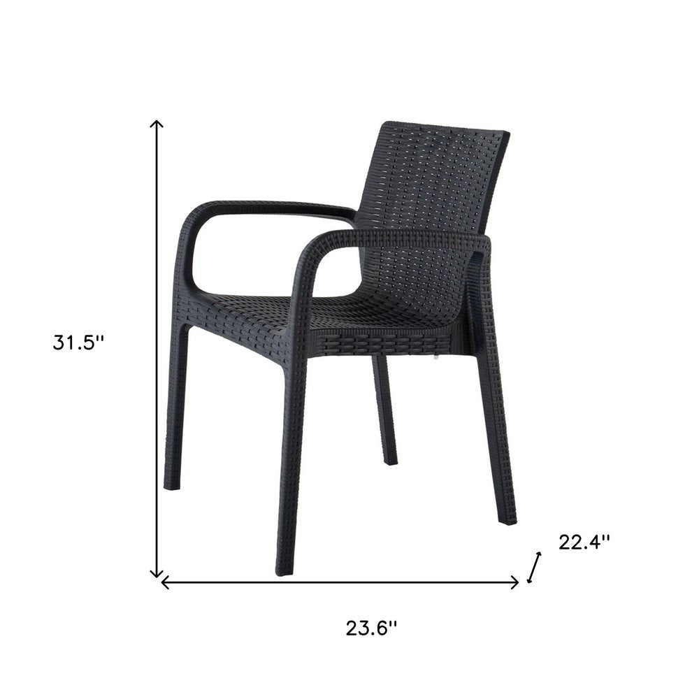 Set of Two Black Faux Rattan Heavy Duty Plastic Outdoor Stacking Arm Chairs on a white background