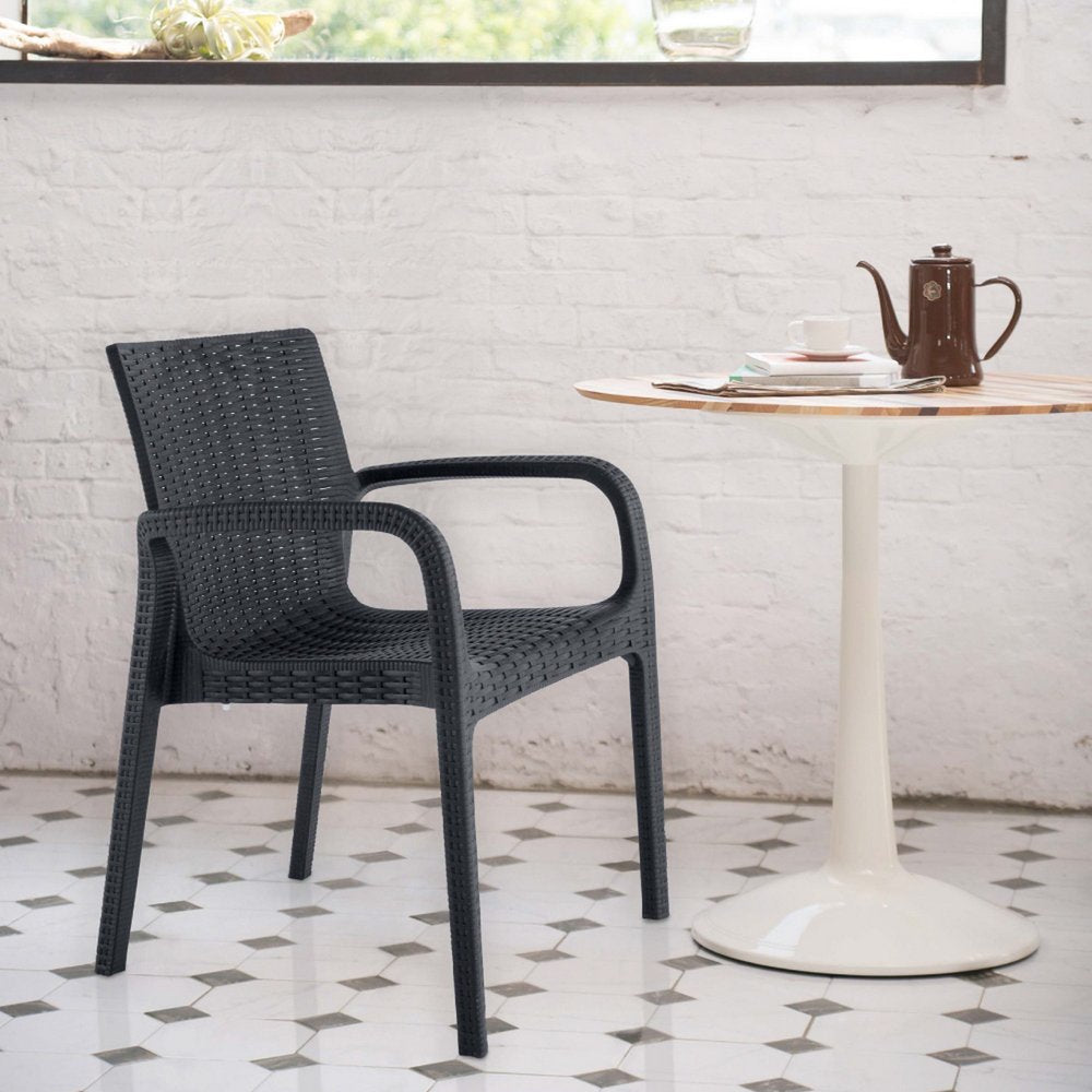 Set of Two Black Faux Rattan Heavy Duty Plastic Outdoor Stacking Arm Chairs on a white background