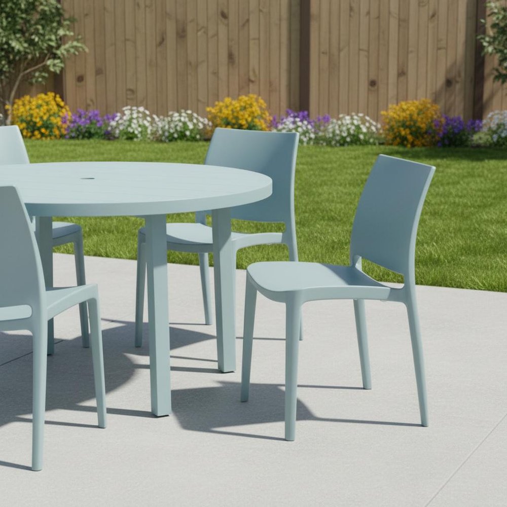 Set of Four Baby Blue Heavy Duty Plastic Outdoor Stacking Dining Chairs in a home interior