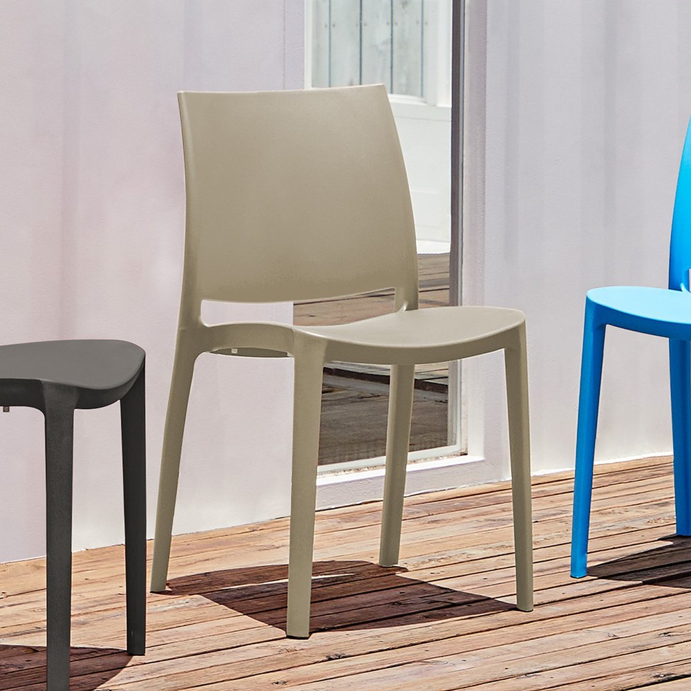 Set of Four Taupe Heavy Duty Plastic Outdoor Stacking Dining Chairs in a home interior