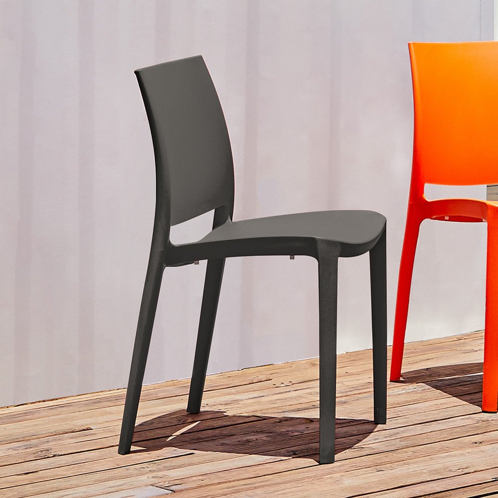 Set of Four Dark Gray Heavy Duty Plastic Outdoor Stacking Dining Chairs on a white background
